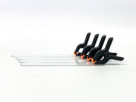 Прищіпка (контроль сходу волосіні) для завезення