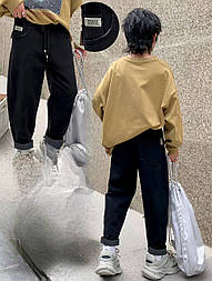 Модні стильні джинси утеплені на мікрохутро для дитини з високою посадкою унісекс у чорному кольорі у 26 і 28 розмірі