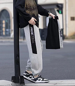 Теплі спортивні штани для хлопчика з манжетом