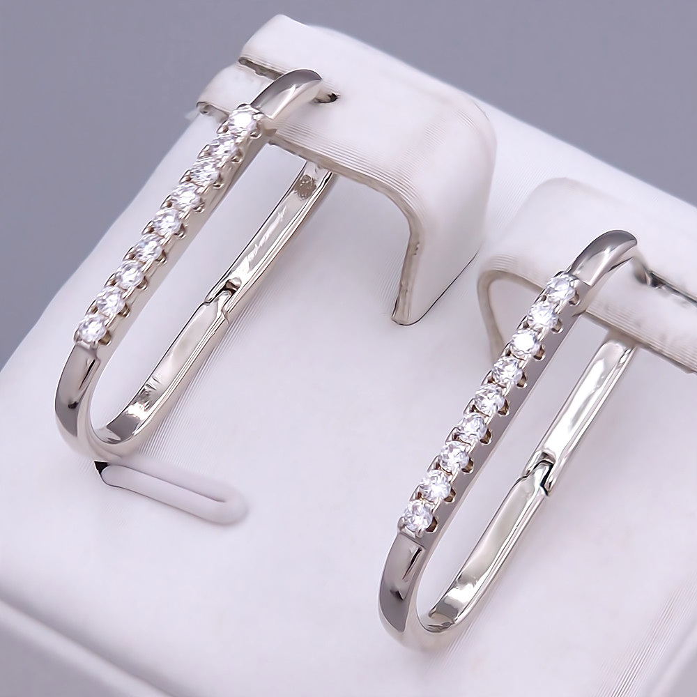 Сережки ХР. Родій. Камені: білий циркон. Довжина: 26 мм. Ширина: 2 мм.