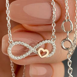 Срібне кольє з золотими накладками з фіанітами в формі знака безкінечності і сердечка (2 см) РН-033