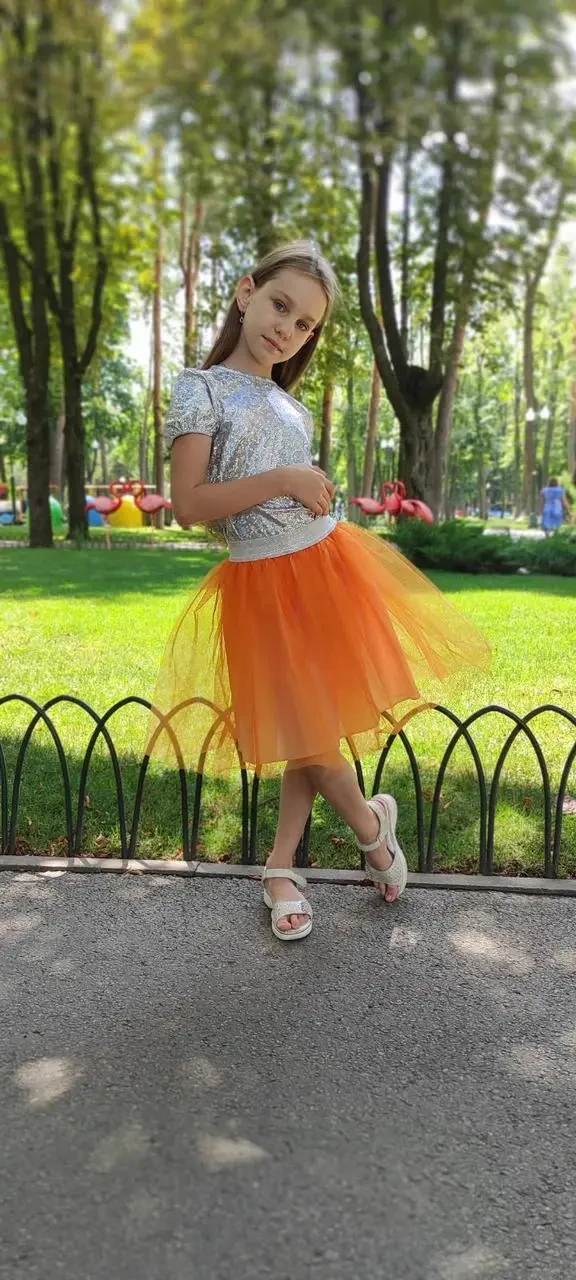 Спідниця із фатина для дівчинки помаранчевого кольору двошарова зі срібним поясом р. 104-170
