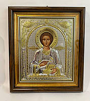 Икона Святого Пантелеймона серебряная в деревянной раме 28х32см