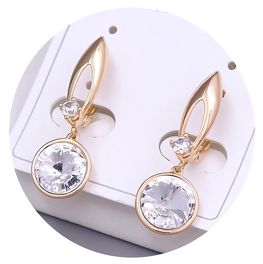 Сережки XР. Позолота 18К. Камені: Swarovski білого кольору та циркон. Довжина: 25 мм. Ширина: 10 мм.