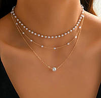 Багатошарове намисто-чокер із намистинами штучних перлів у золотому кольорі