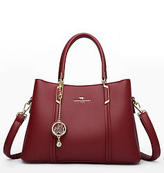 Жіноча сумочка з натуральної шкіри з брелком  кішки темно-червона