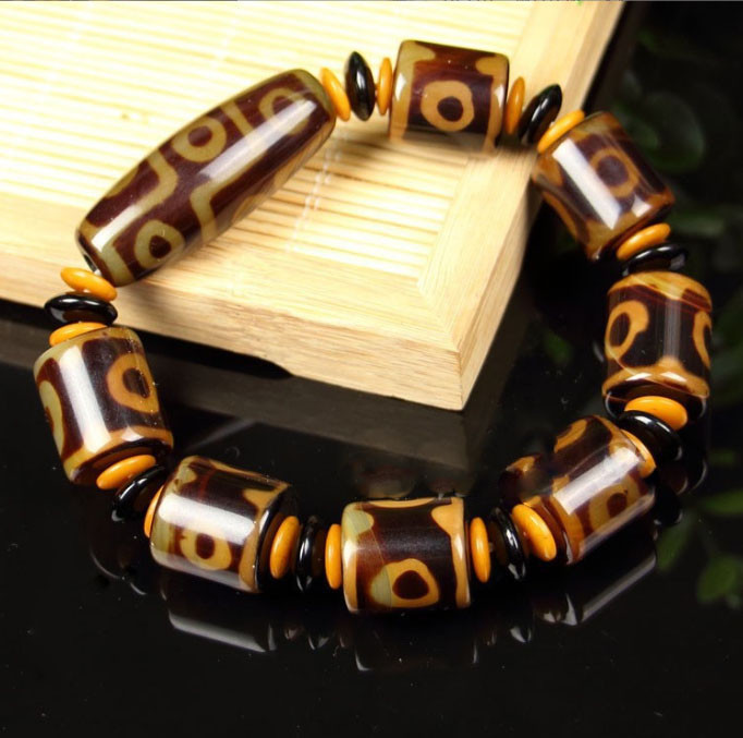 Браслет Коричневий ДЗИ 9 очей і сім на 3 очі