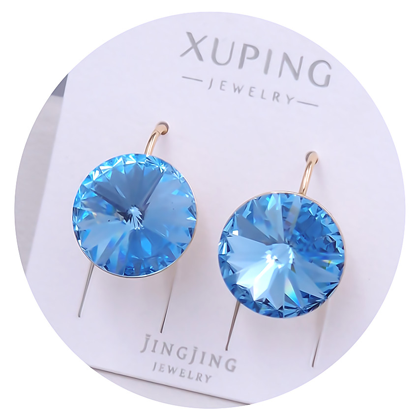 Сережки XР. Позолота 18К. Камені: Swarovski блакитного кольору. Довжина: 18 мм. Ширина: 13 мм.