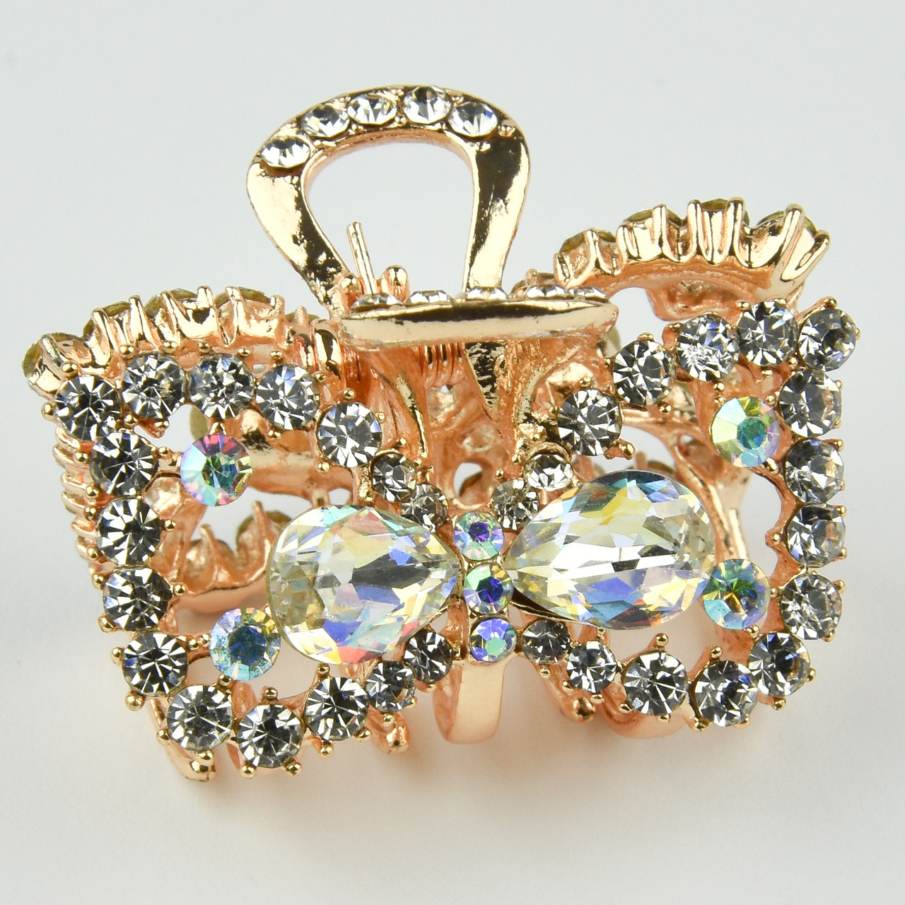 Шпилька краб металевої фірми Zaya золотистого кольору бантик із переливними стразами розмір 25х30х25 мм