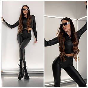 Жіночий чорний облягаючий брючний костюм з еко-шкіри