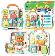 Пластиковий розкладний бізіборд зі світолом і звуком Чарівна валізка