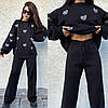 Жіночий молодіжний зимовий стильний в'язаний костюм: светр з сердечками та широкі штани, фото 4
