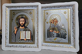 Пара Ікон Спасителя та Почаївська Пресвята Богородиця в білому дерев'яному фігурному кіоті під склом, розмір 52*42, лик 30*40