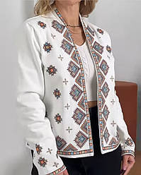 Вишитий жіночий піджак з джинсової тканини в молочному кольорі з різнокольоровою вишивкою розміри S,M,L.