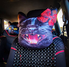 Подушка - підголовник в машину Чорна кішка Мальва з червоним бантом і великою посмішкою