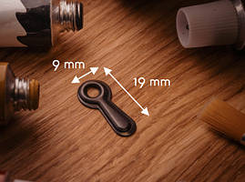 Фіксатор для рамок металевий. 20х9мм