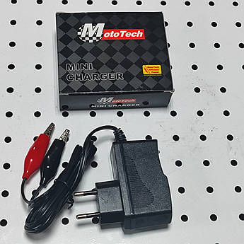 Універсальний імпульсний зарядний пристрій 12V до мопедів та скутерів.HONDA, SUZUKI, YAMAHA