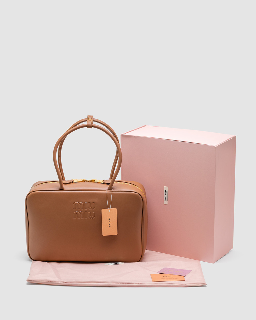 Коричнева шкіряна жіноча сумка Miu Miu Leather Top Handle