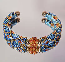 Браслет з бісеру на каркасі блакитний.з помаранчевим