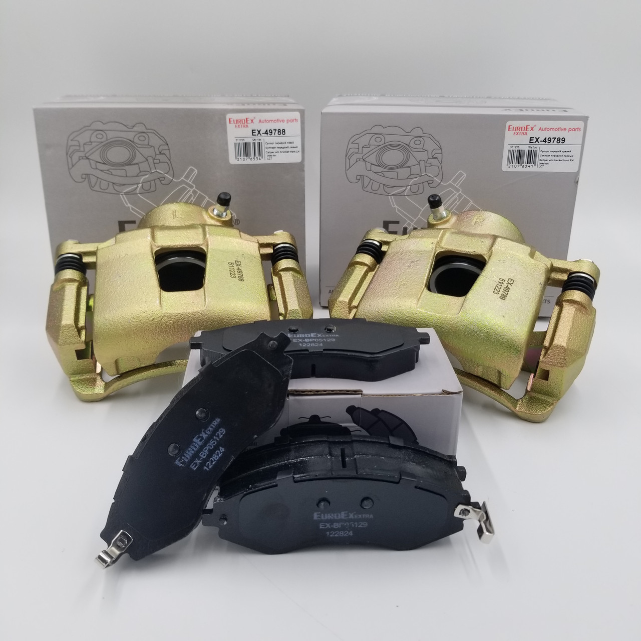 Передні супорти Лачетті комплект з колодками виробник Угорщина