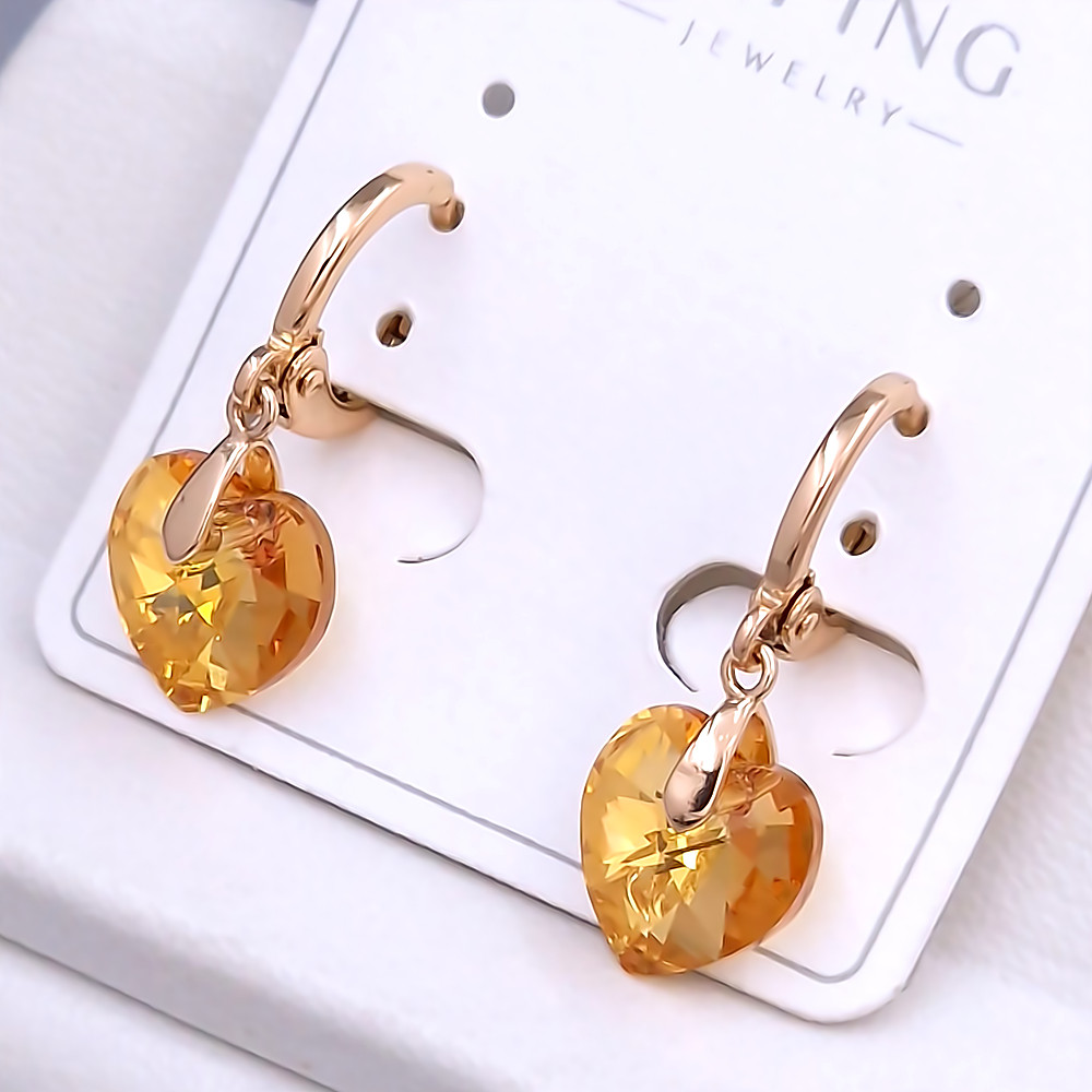 Сережки XР. Позолота 18К. Камені: Swarovski синій колір та білий циркон. Довжина: 25 мм. Ширина: 10 мм.