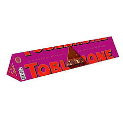 Шоколад молочний Toblerone з родзинками та подрібненими горіхами, 100г (Тоблерон)
