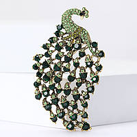 Брошка металева золотиста павич із смарагдовими кристалами розмір виробу 75х45 мм