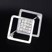 Брошка-бавка металева на сріблястій основі з білими стразами розмір виробу 35х25 мм