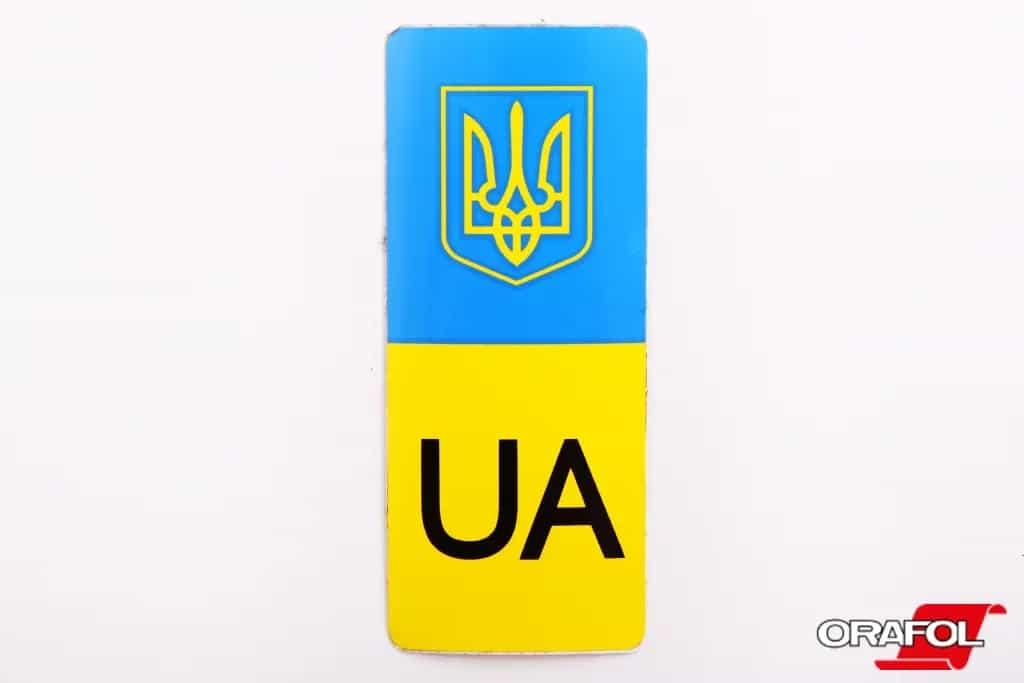 Наклейка на номерний знак мала UA з гербом і прапором 4*10см