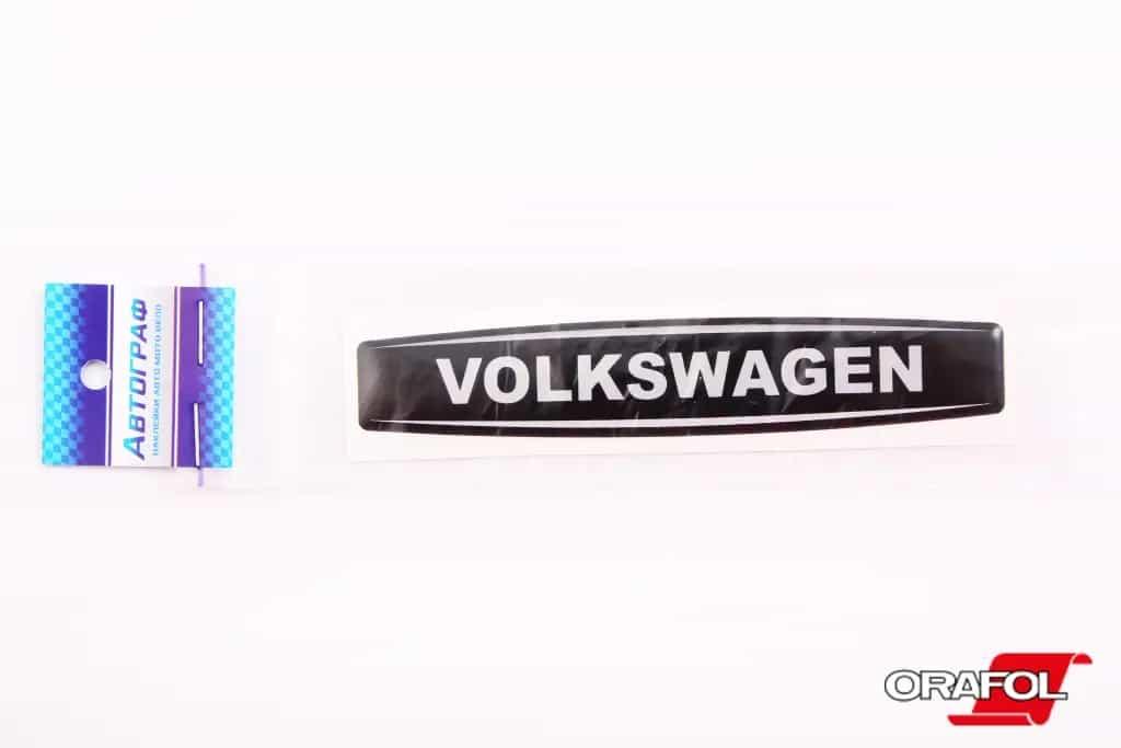 Наклейка емблема силікон Volkswagen чорний фон, срібл. 2*12см "Автограф"