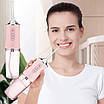 Іригатор для чищення зубів та порожнини рота Oral Irrigator з акумулятором та змінними насадками. Колір: рожевий, фото 6