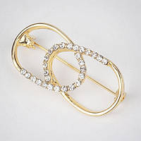 Брошка-бавка металева на золотистій основі з білими стразами розмір виробу 40х20 мм