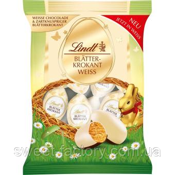 Шоколадні яйця Lindt Blätterkrokant-Eier Weiße Schokolade 85g, фото 1