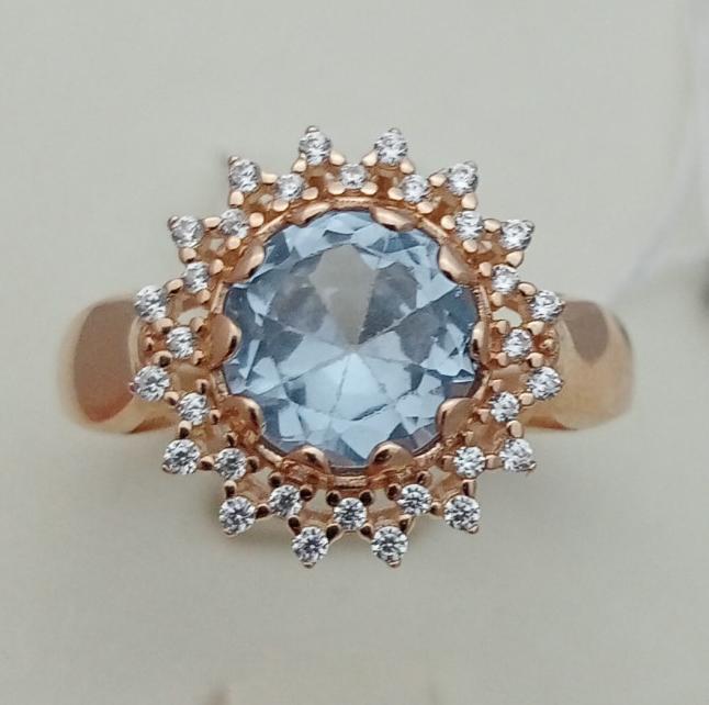 Золота каблучка з топазом і фіанітами.