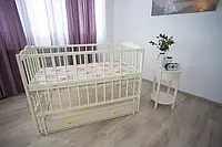 Екологічне ліжечко з бука в кольорі слонова кістка відкидний бортик Функціональна дитяча люлька з гойданням і шухлядою