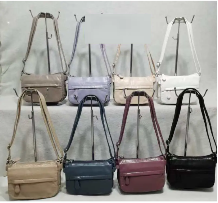 Сумка жіноча варенка на блискавці з довгим ремінцем зі штучної шкіри в різних варіантах Liza, фото 1