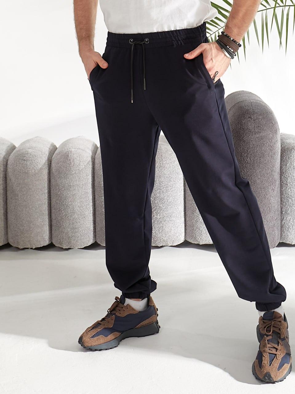 Чоловічі якісні та зручні спортивні весняні однотонні завужені штани з резинками по низу, фото 1