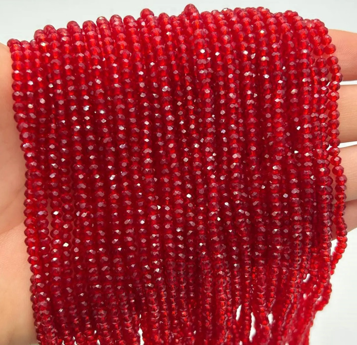 Намистини кришталеві 2,4х3 мм, червоний прозорий (уп.165-175 шт)