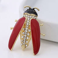 Брошка металева золотиста червоний жук з інкрустованими стразами розмір виробу 40х30 мм