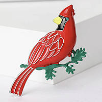 Брошка металева на сріблястій основі червона пташка на гілочці покрита кольоровою емаллю розмір 55х40 мм