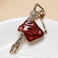 Брошка металева на золотистій основі балерина з білими кристалами покрита кольоровою емаллю розмір 60х30 мм