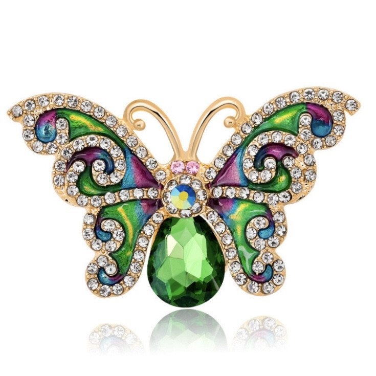 Брошка на золотистій основі великий метелик із білими стразами покрита кольоровою емаллю розмір 45х35 мм