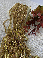 Стразова цепочка Персиковий камінь 2мм в золотій оправі (1 метр),