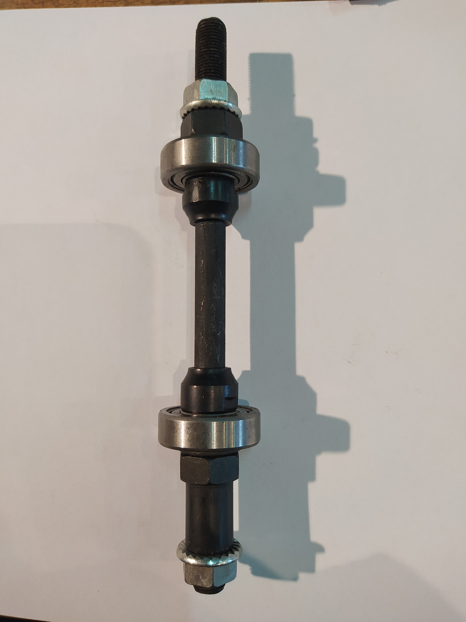 Вісь колеса заднього велосипедна (на пром підшипниках 902R) FM