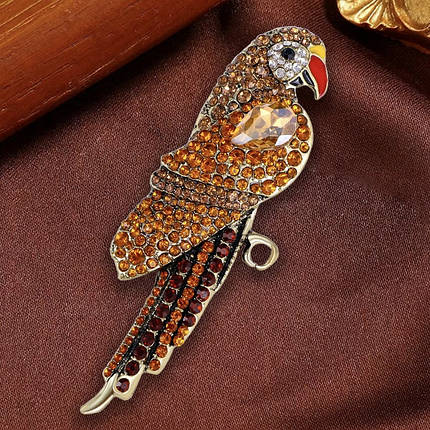 Брошка металева на золотистій основі папуг із жовтими та жовтими кристалами розмір 95х35 мм, фото 1