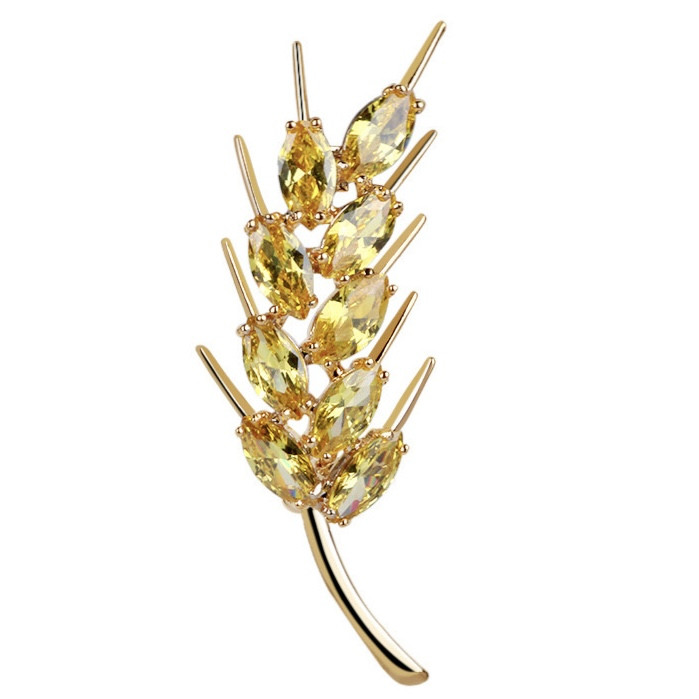 Брошка на золотистій основі клопочка з жовтими камінчиками, що переливаються, розмір виробу 50х20 мм