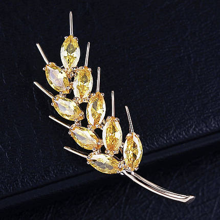 Брошка на золотистій основі клопочка з жовтими камінчиками, що переливаються, розмір виробу 50х20 мм, фото 2