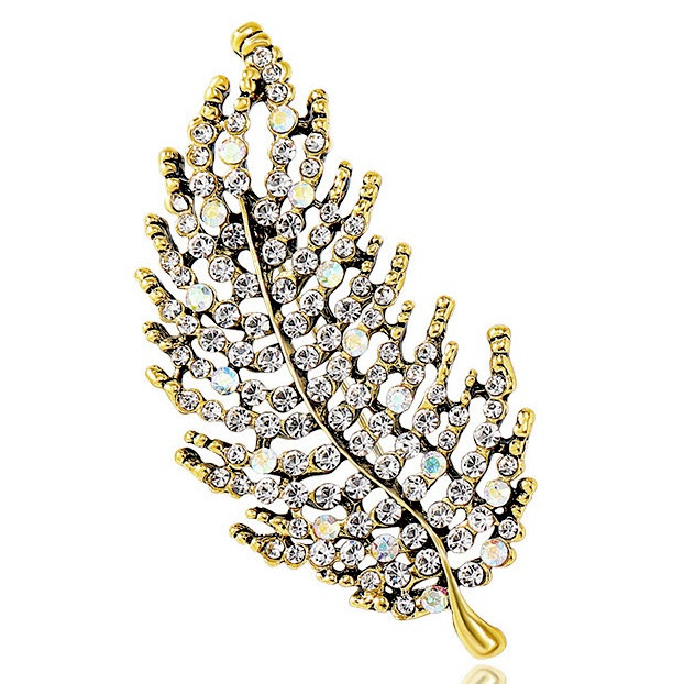 Брошка на золотистій основі листочок із камінчиками, що переливаються, розмір виробу 70х35 мм