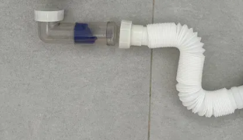 Сифон 40 мм із універсальним сухим клапаном і гофротрубою (зі зворотним клапаном)