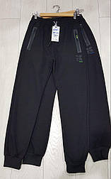 Спортивні штани на хлопчика з манжетами в чорному кольорі в 170 розмірі